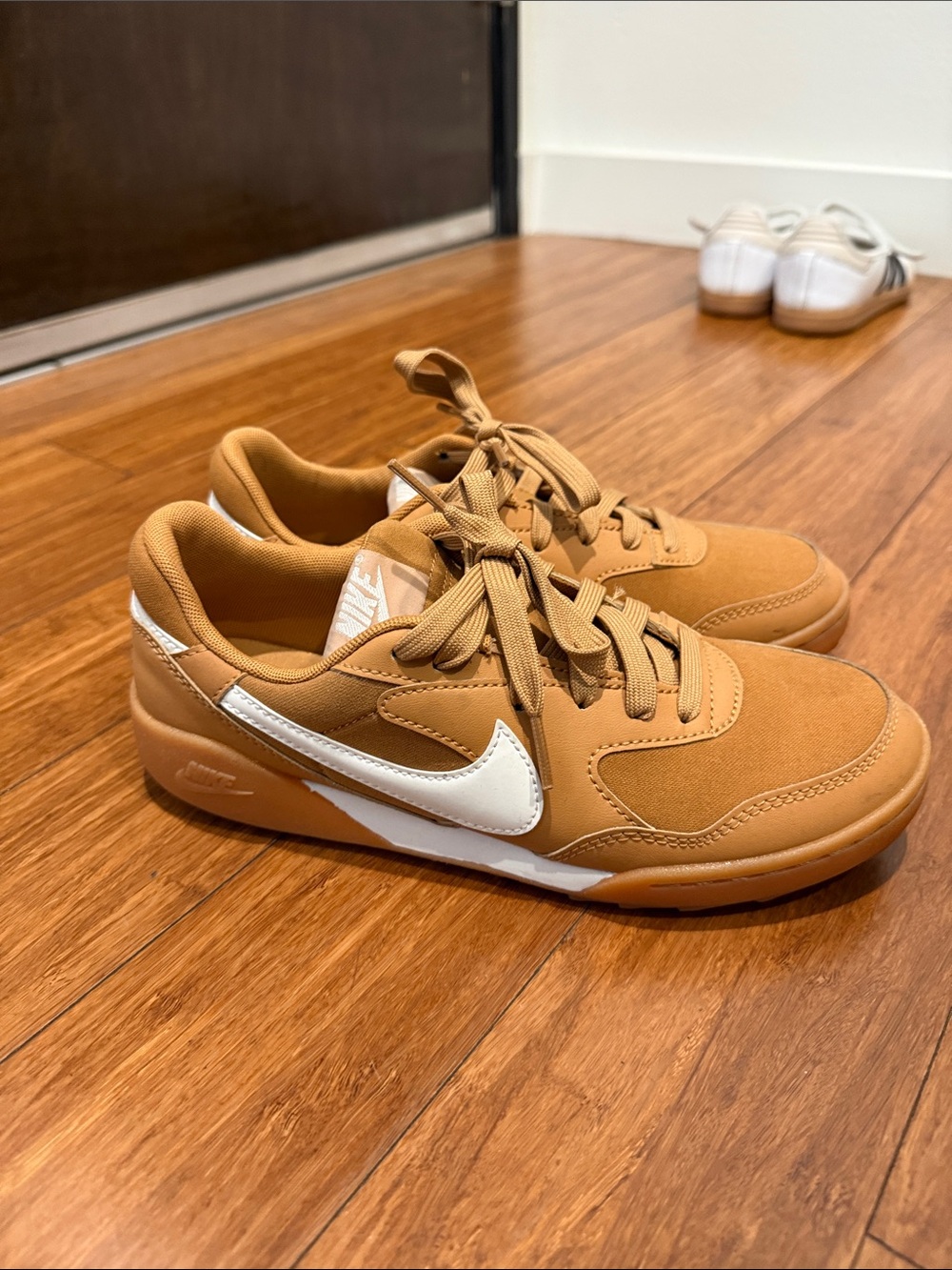 Nike Tan Low-Top Sneakers with White Swoosh